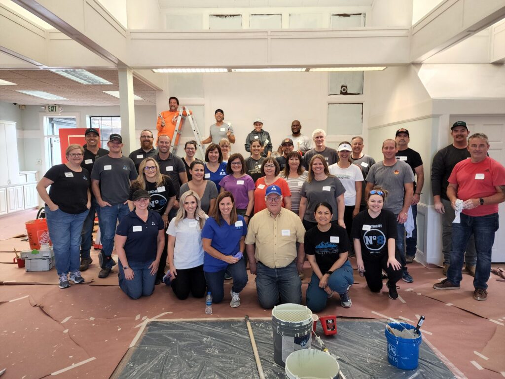 A large group of men and women posing for a photo.