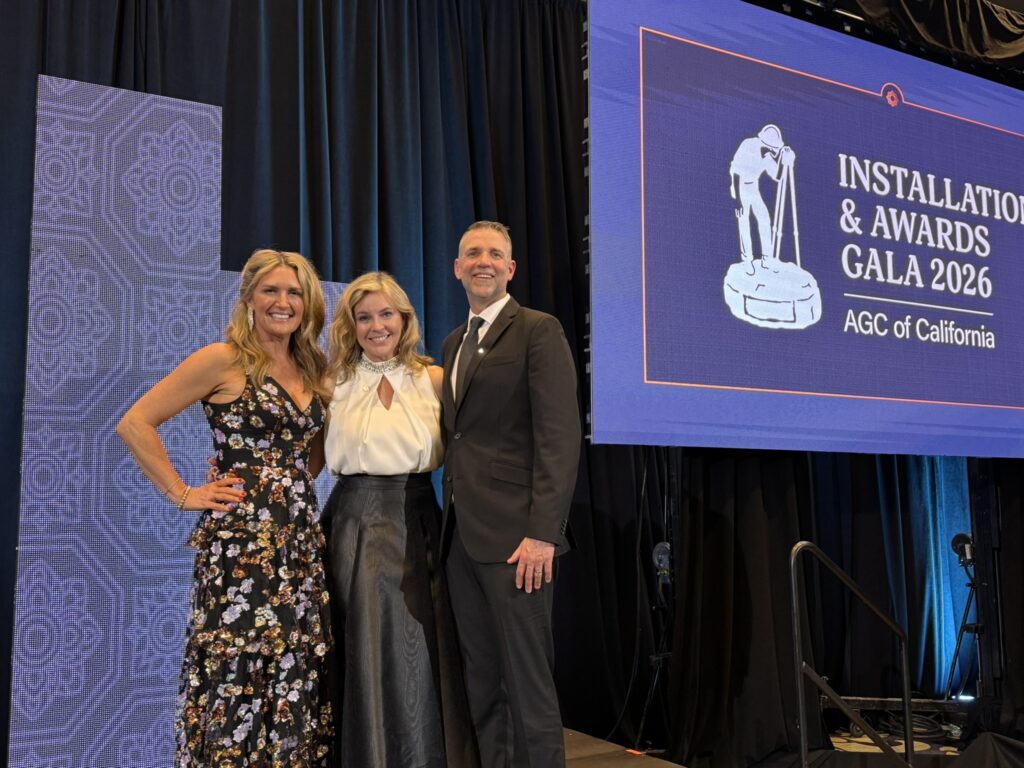 Three People posing at the AGC Community Service Awards