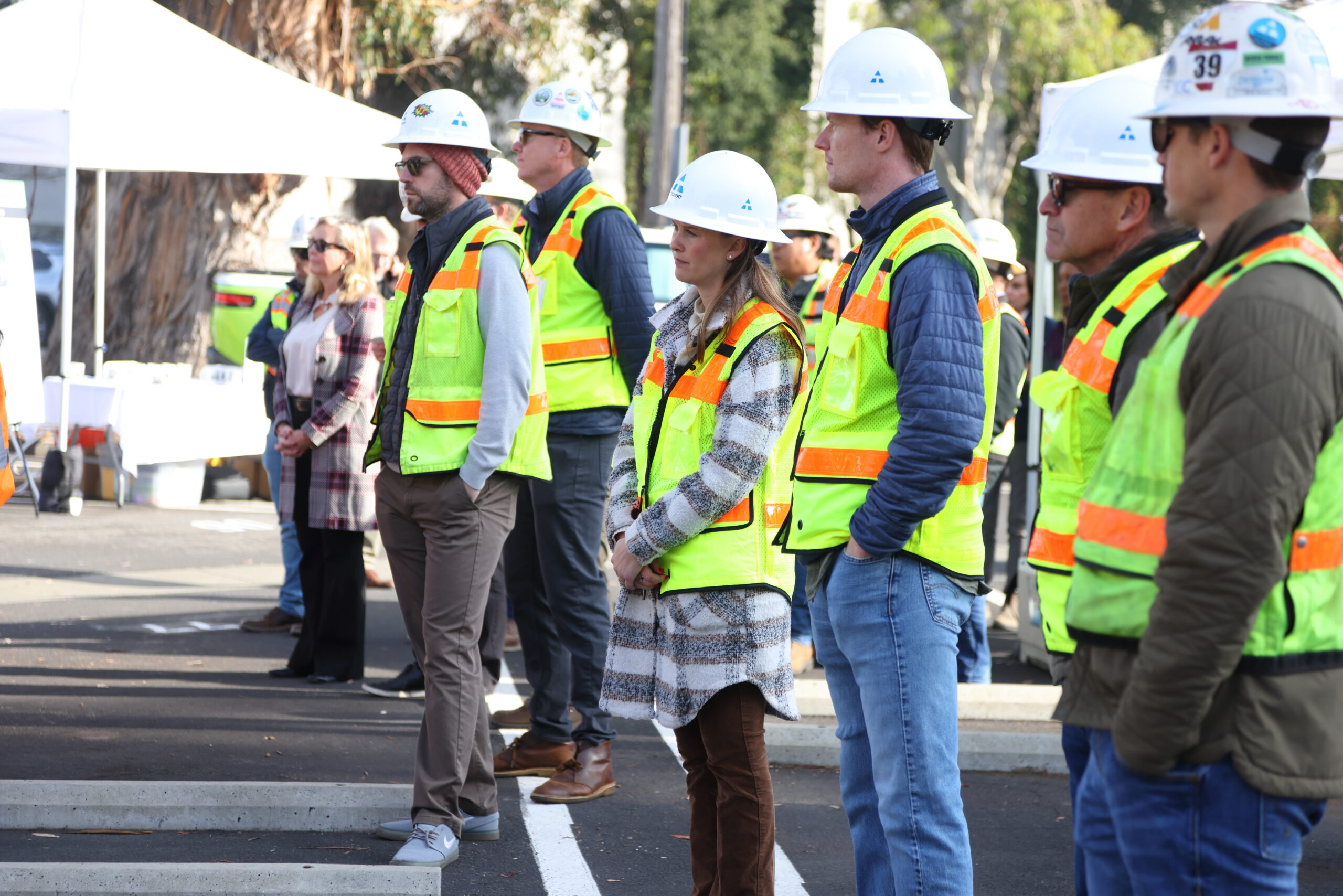 SM-82 Groundbreaking showing several workers in construction vests and hats.